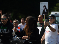 A hundred people take part in a bike demonstration to mark the second anniversary of Mahsa Amini's death for the Woman, Life, and Freedom mo...