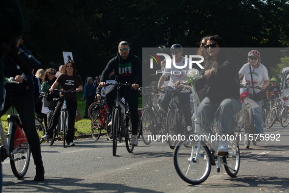 A hundred people take part in a bike demonstration to mark the second anniversary of Mahsa Amini's death for the Woman, Life, and Freedom mo...