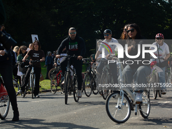 A hundred people take part in a bike demonstration to mark the second anniversary of Mahsa Amini's death for the Woman, Life, and Freedom mo...