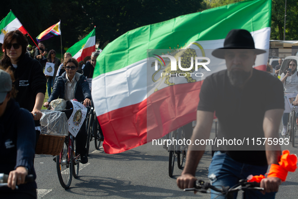 A hundred people take part in a bike demonstration to mark the second anniversary of Mahsa Amini's death for the Woman, Life, and Freedom mo...