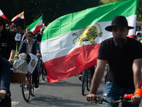 A hundred people take part in a bike demonstration to mark the second anniversary of Mahsa Amini's death for the Woman, Life, and Freedom mo...