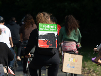 A hundred people take part in a bike demonstration to mark the second anniversary of Mahsa Amini's death for the Woman, Life, and Freedom mo...