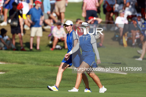 GAINESVILLE, VIRGINIA - SEPTEMBER 14: Emily Kristine Pedersen of Team Europe and Carlota Ciganda of Team Europe walk on the 14th fairway dur...