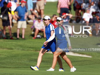 GAINESVILLE, VIRGINIA - SEPTEMBER 14: Emily Kristine Pedersen of Team Europe and Carlota Ciganda of Team Europe walk on the 14th fairway dur...