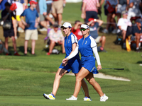 GAINESVILLE, VIRGINIA - SEPTEMBER 14: Emily Kristine Pedersen of Team Europe and Carlota Ciganda of Team Europe walk on the 14th fairway dur...