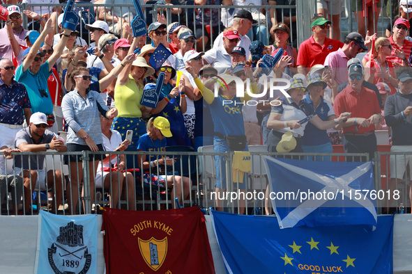 GAINESVILLE, VIRGINIA - SEPTEMBER 14:  Fans in Team Europe spirit wear cheer from the gallery at the 1st tee during Day Two of the Solheim C...