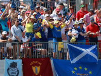 GAINESVILLE, VIRGINIA - SEPTEMBER 14:  Fans in Team Europe spirit wear cheer from the gallery at the 1st tee during Day Two of the Solheim C...