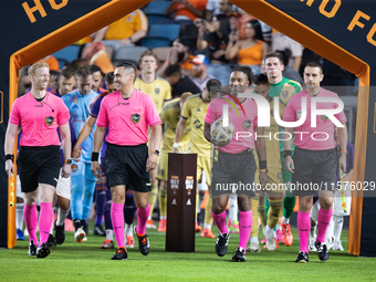 The referees walk onto the pitch ahead of a match against Real Salt Lake at Shell Energy Stadium in Houston, Texas, on September 14, 2024. (