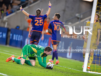 Moments after a goal, Houston Dynamo players Griffin Dorsey and Ezequiel Ponce celebrate behind Real Salt Lake goalkeeper Gavin Beavers (35)...