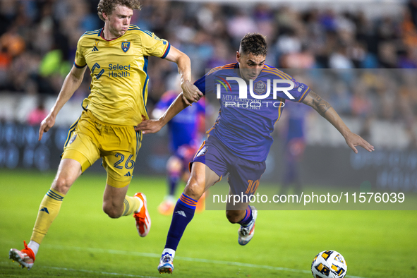 Real Salt Lake defender Philip Quinton (26) chases Houston Dynamo forward Ezequiel Ponce (10) down the field during a match between Houston...