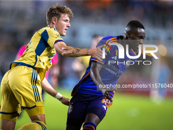 Real Salt Lake midfielder Bode Hidalgo (19) grabs Houston Dynamo forward Ibrahim Aliyu's arm during a match between Houston Dynamo and Real...