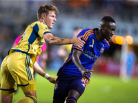 Real Salt Lake midfielder Bode Hidalgo (19) grabs Houston Dynamo forward Ibrahim Aliyu's arm during a match between Houston Dynamo and Real...