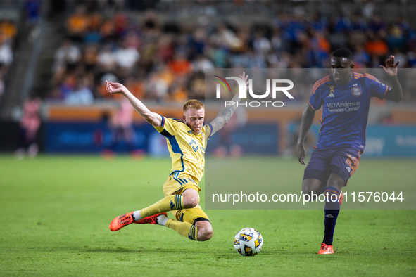 Real Salt Lake defender Justen Glad (15) steals the ball from Houston Dynamo forward Ibrahim Aliyu (18) during a match between Houston Dynam...