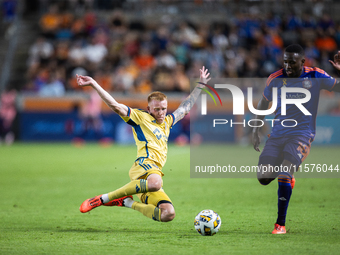 Real Salt Lake defender Justen Glad (15) steals the ball from Houston Dynamo forward Ibrahim Aliyu (18) during a match between Houston Dynam...