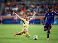 Real Salt Lake defender Justen Glad (15) steals the ball from Houston Dynamo forward Ibrahim Aliyu (18) during a match between Houston Dynam...