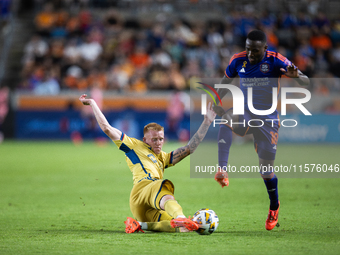 Real Salt Lake defender Justen Glad (15) steals the ball from Houston Dynamo forward Ibrahim Aliyu (18) during a match between Houston Dynam...