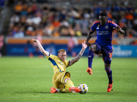 Real Salt Lake defender Justen Glad (15) steals the ball from Houston Dynamo forward Ibrahim Aliyu (18) during a match between Houston Dynam...