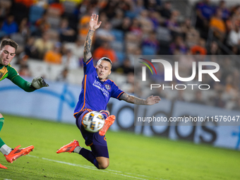 Houston Dynamo midfielder Sebastian Kowalczyk (27) blocks a kick from Real Salt Lake goalkeeper Gavin Beavers (35) during a match between Ho...