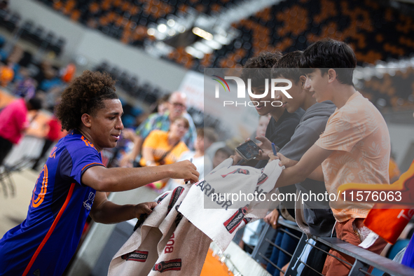 Houston Dynamo midfielder Coco Carrasquilla signs a towel for young fans after a match between Houston Dynamo and Real Salt Lake at Shell En...