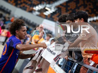 Houston Dynamo midfielder Coco Carrasquilla signs a towel for young fans after a match between Houston Dynamo and Real Salt Lake at Shell En...