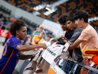 Houston Dynamo midfielder Coco Carrasquilla signs a towel for young fans after a match between Houston Dynamo and Real Salt Lake at Shell En...