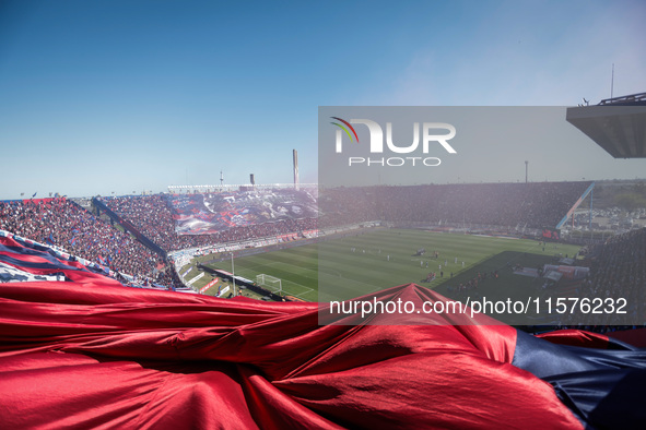 Fans of San Lorenzo cheer for their team before a match between San Lorenzo and Velez as part of Copa de la Liga 2024 at Estadio Pedro Bideg...