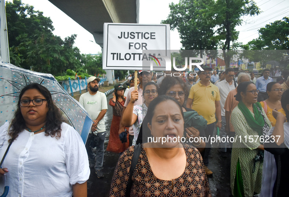 Citizens march along a street during a protest condemning the rape and murder of a trainee medic at a government-run hospital in Kolkata, In...