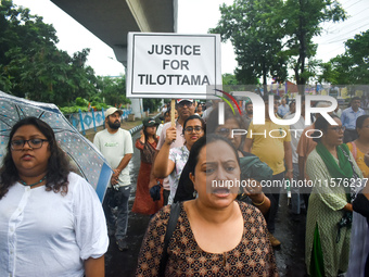 Citizens march along a street during a protest condemning the rape and murder of a trainee medic at a government-run hospital in Kolkata, In...