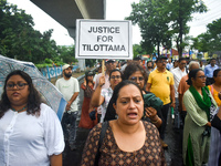 Citizens march along a street during a protest condemning the rape and murder of a trainee medic at a government-run hospital in Kolkata, In...