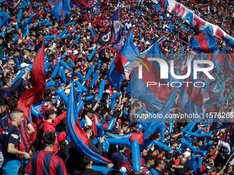 Fans of San Lorenzo cheer for their team before a match between San Lorenzo and Velez as part of Copa de la Liga 2024 at Estadio Pedro Bideg...