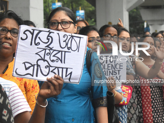 Women march along a street during a protest condemning the rape and murder of a trainee medic at a government-run hospital in Kolkata, India...