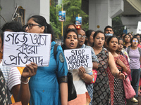 Women march along a street during a protest condemning the rape and murder of a trainee medic at a government-run hospital in Kolkata, India...