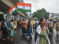 Medics chant slogans as they attend a protest condemning the rape and murder of a trainee medic at a government-run hospital in Kolkata, Ind...