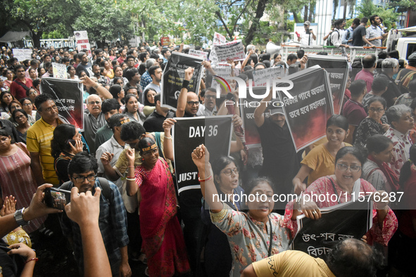 Citizens march along a street during a protest condemning the rape and murder of a trainee medic at a government-run hospital in Kolkata, In...