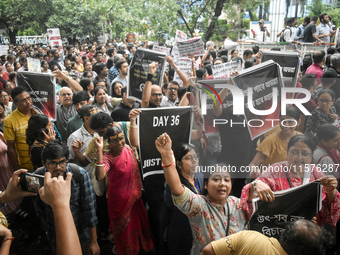 Citizens march along a street during a protest condemning the rape and murder of a trainee medic at a government-run hospital in Kolkata, In...