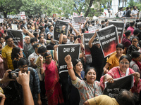 Citizens march along a street during a protest condemning the rape and murder of a trainee medic at a government-run hospital in Kolkata, In...