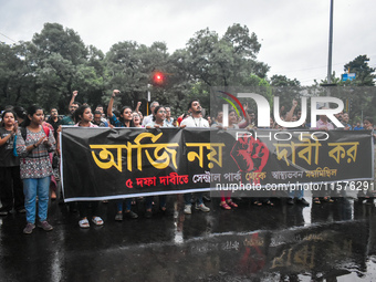 Citizens march along a street during a protest condemning the rape and murder of a trainee medic at a government-run hospital in Kolkata, In...