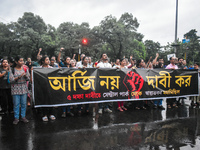 Citizens march along a street during a protest condemning the rape and murder of a trainee medic at a government-run hospital in Kolkata, In...