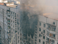 Firefighters extinguish a high-rise building that is hit by an aerial bomb, in Kharkiv, Ukraine, on September 15, 2024. (