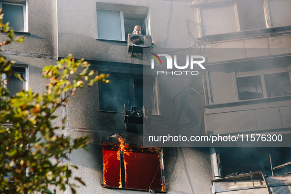 Despite the mortal danger, the man refuses to leave the house without his dog, in Kharkiv, Ukraine, on September 15, 2024. 