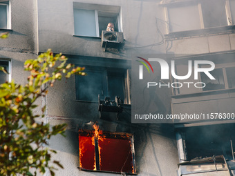 Despite the mortal danger, the man refuses to leave the house without his dog, in Kharkiv, Ukraine, on September 15, 2024. (