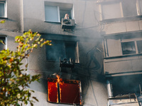 Despite the mortal danger, the man refuses to leave the house without his dog, in Kharkiv, Ukraine, on September 15, 2024. (