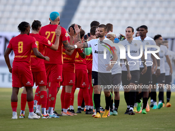 Soccer players from Birkirkara and Hibernians perform the ''high-five'' gesture with each other prior to the Malta 360 Sports Premier League...