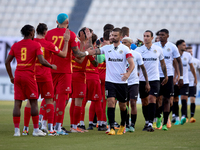 Soccer players from Birkirkara and Hibernians perform the ''high-five'' gesture with each other prior to the Malta 360 Sports Premier League...