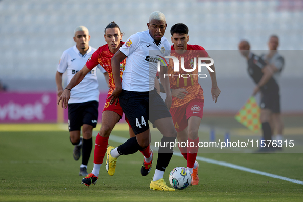 In Ta' Qali, Malta, on September 14, 2024, Nunes Silva Pedro Henrique of Hibernians moves forward with the ball ahead of Alexander Satariano...