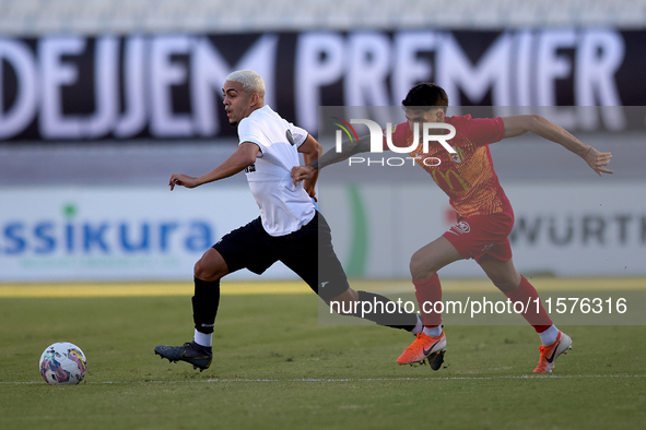 In Ta' Qali, Malta, on September 14, 2024, Kleiton do Monte Lima Basilio of Hibernians is closely followed by Leandro Lautaro Lacunza of Bir...