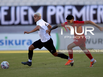 In Ta' Qali, Malta, on September 14, 2024, Kleiton do Monte Lima Basilio of Hibernians is closely followed by Leandro Lautaro Lacunza of Bir...