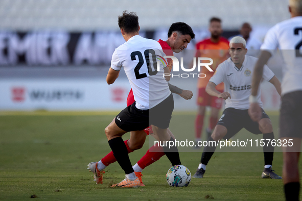 In Ta' Qali, Malta, on September 14, 2024, Leandro Lautaro Lacunza of Birkirkara competes for the ball with Federico Falcone of Hibernians d...