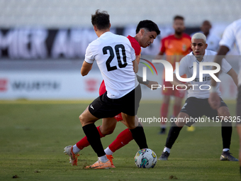 In Ta' Qali, Malta, on September 14, 2024, Leandro Lautaro Lacunza of Birkirkara competes for the ball with Federico Falcone of Hibernians d...