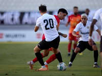 In Ta' Qali, Malta, on September 14, 2024, Leandro Lautaro Lacunza of Birkirkara competes for the ball with Federico Falcone of Hibernians d...